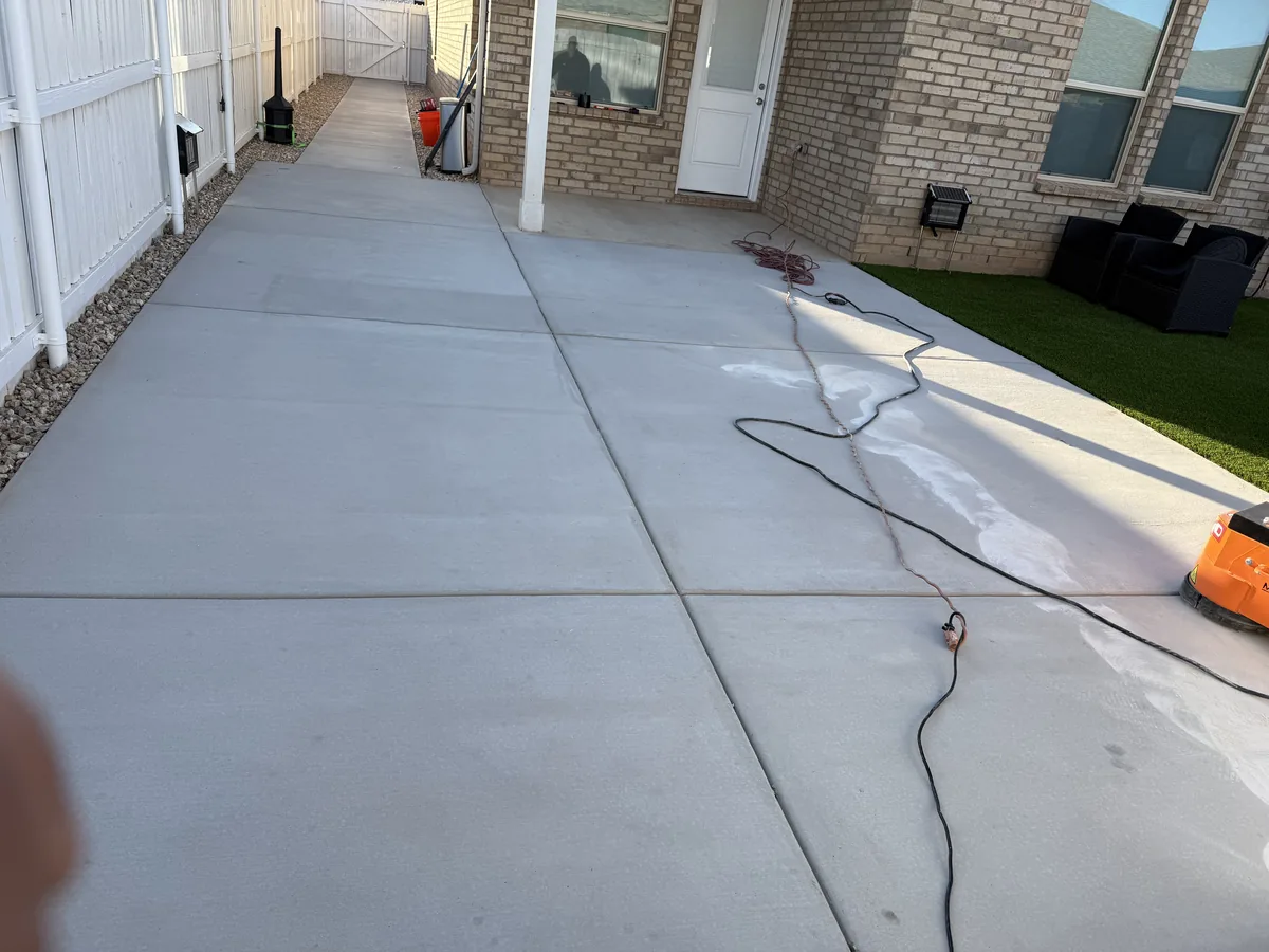 Bare concrete patio cleaned and prepped before epoxy