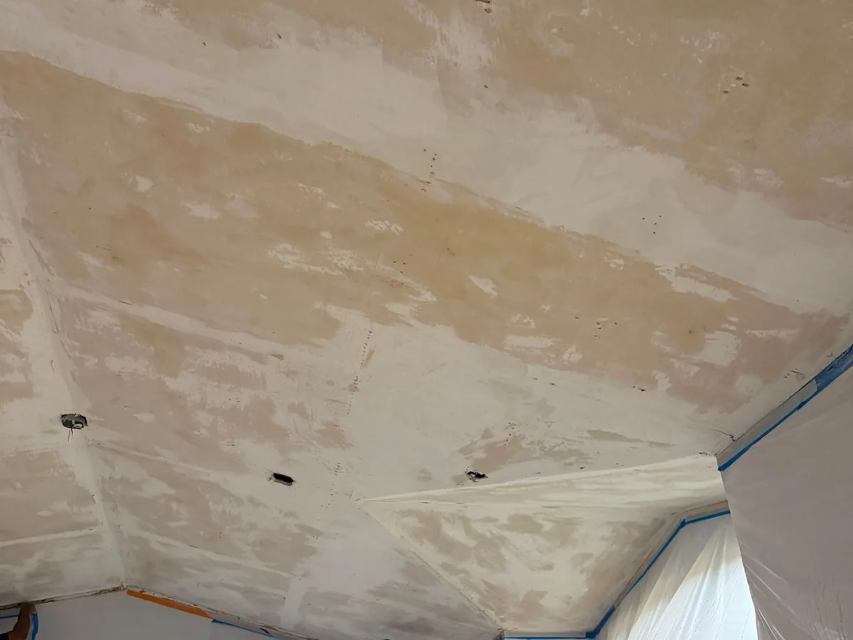 Interior wall with fresh texture applied over a patched area