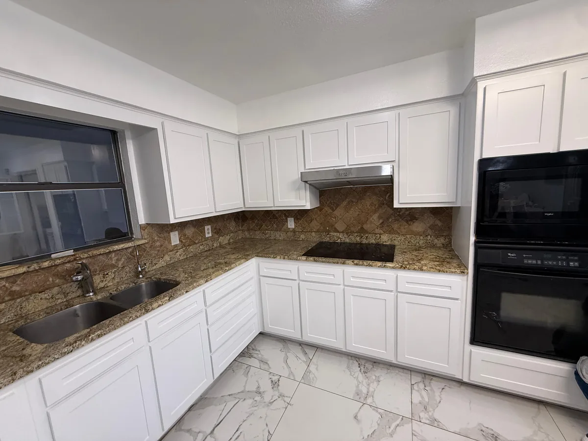 Kitchen with cabinets painted white